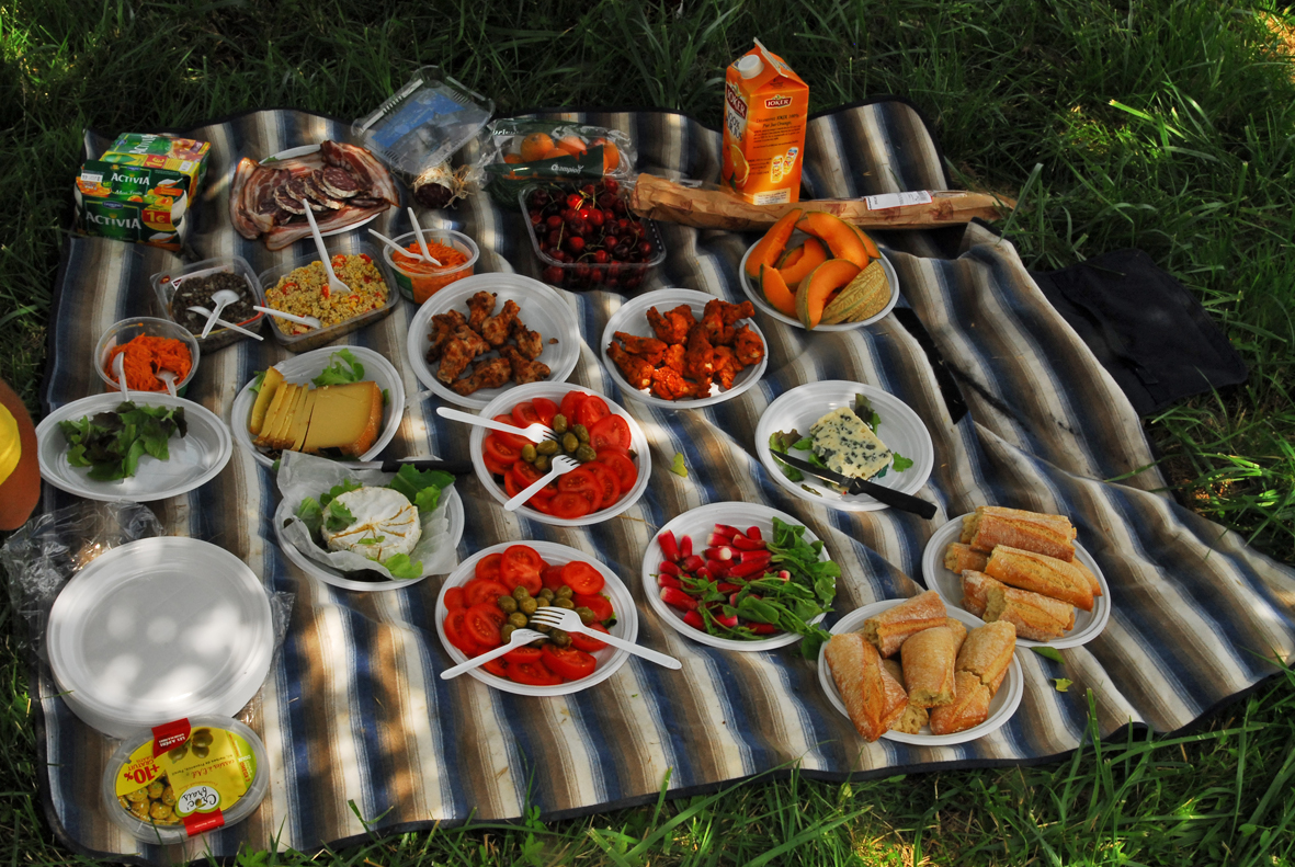 A French cyclists picnic! Baguettes, cheese, meats, olives and salads